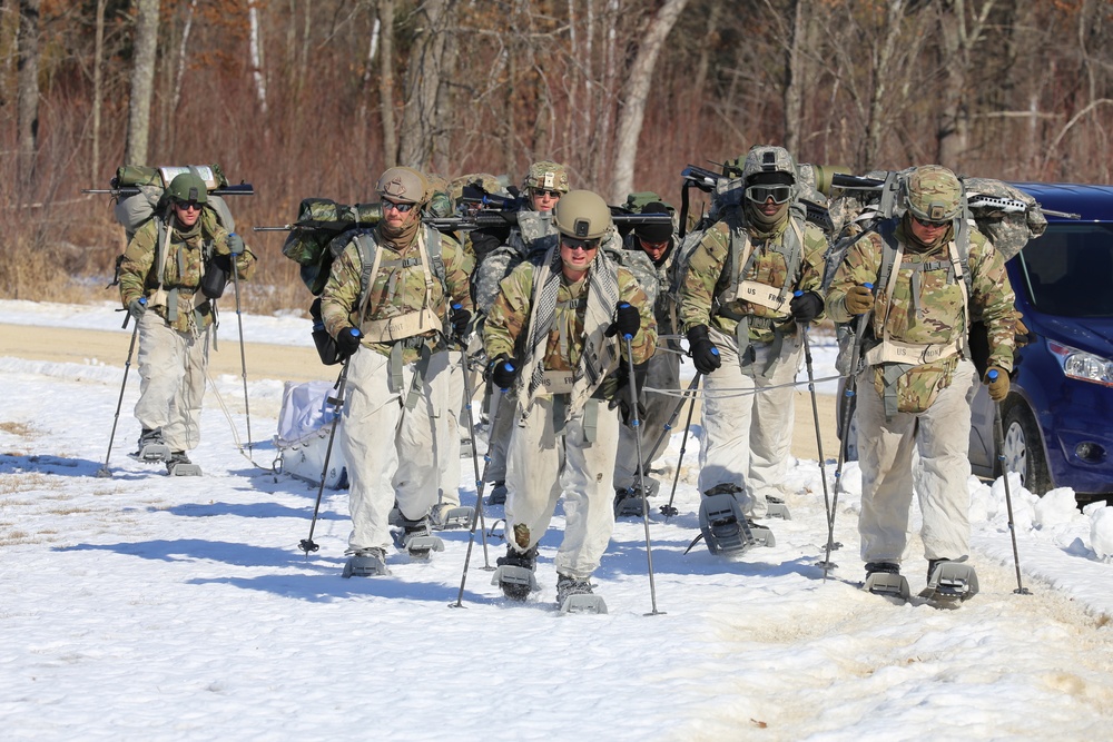 Fort McCoy Cold-Weather Operations Course students practice snowshoeing, ahkio sled use