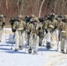 Fort McCoy Cold-Weather Operations Course students practice snowshoeing, ahkio sled use