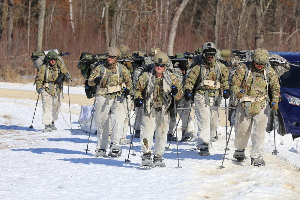 Fort McCoy Cold-Weather Operations Course students practice snowshoeing, ahkio sled use