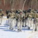 Fort McCoy Cold-Weather Operations Course students practice snowshoeing, ahkio sled use