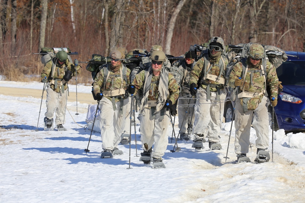 Fort McCoy Cold-Weather Operations Course students practice snowshoeing, ahkio sled use