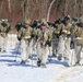 Fort McCoy Cold-Weather Operations Course students practice snowshoeing, ahkio sled use