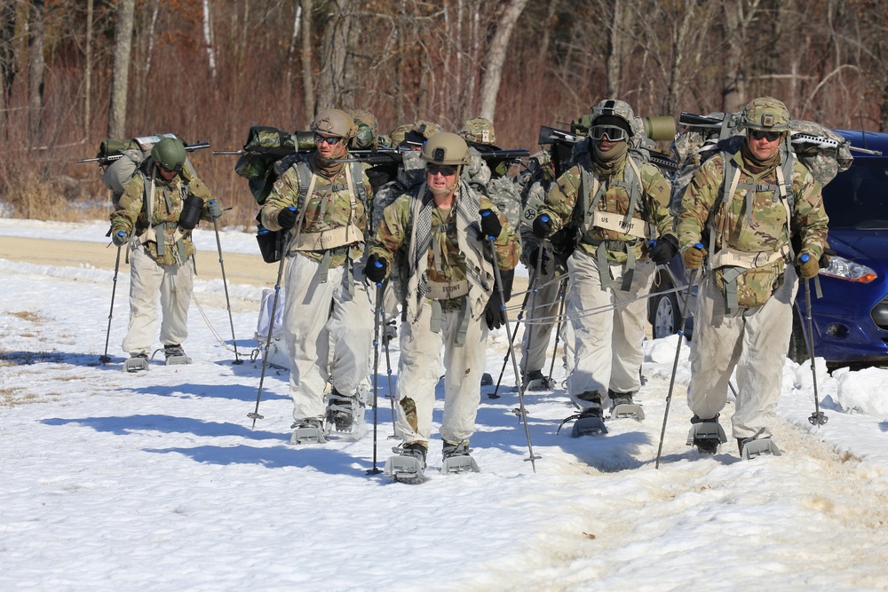 Fort McCoy Cold-Weather Operations Course students practice snowshoeing, ahkio sled use