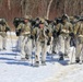 Fort McCoy Cold-Weather Operations Course students practice snowshoeing, ahkio sled use