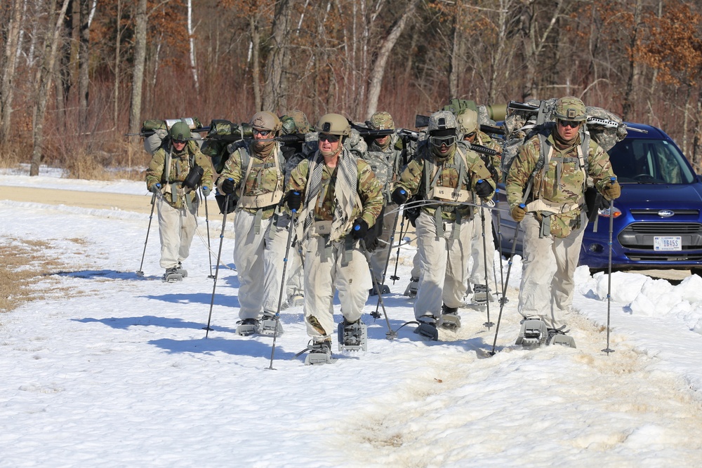 Fort McCoy Cold-Weather Operations Course students practice snowshoeing, ahkio sled use