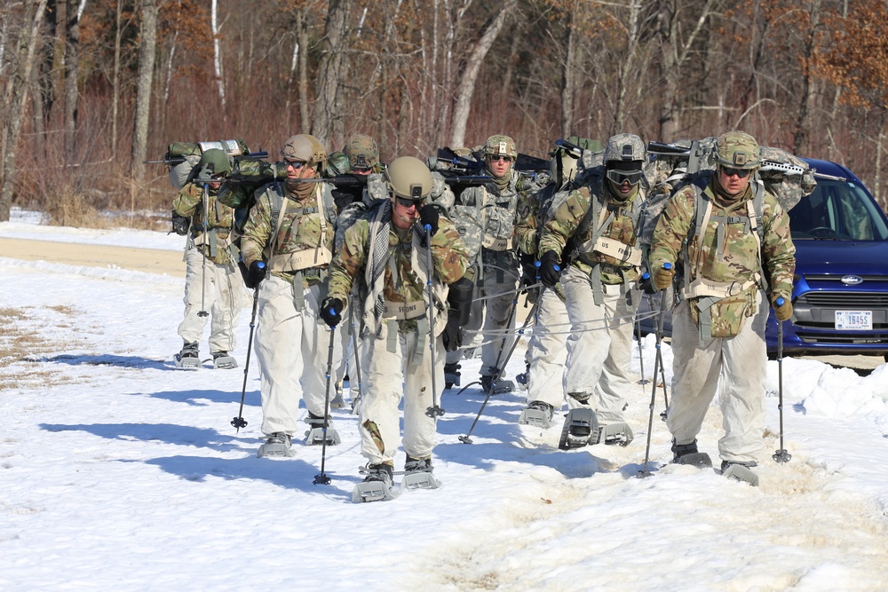 Fort McCoy Cold-Weather Operations Course students practice snowshoeing, ahkio sled use