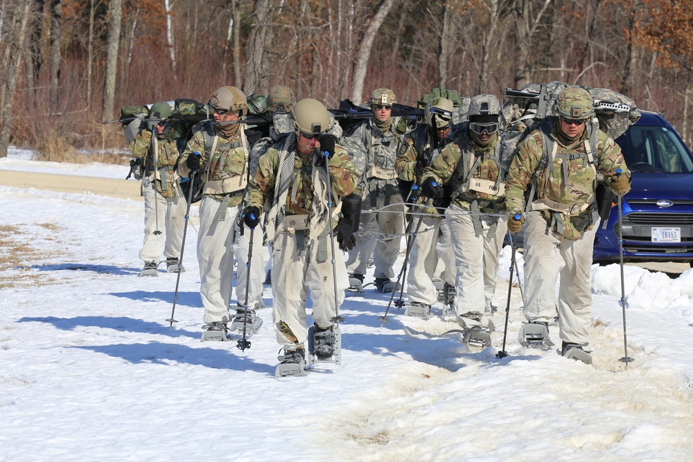 Fort McCoy Cold-Weather Operations Course students practice snowshoeing, ahkio sled use