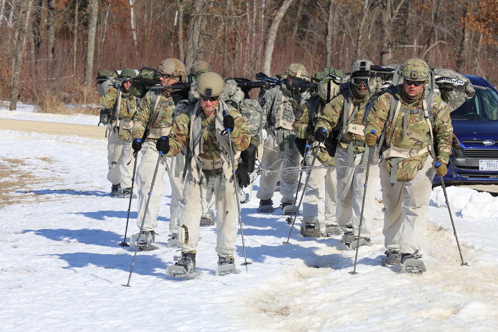 Fort McCoy Cold-Weather Operations Course students practice snowshoeing, ahkio sled use