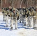 Fort McCoy Cold-Weather Operations Course students practice snowshoeing, ahkio sled use