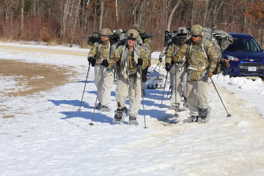 Fort McCoy Cold-Weather Operations Course students practice snowshoeing, ahkio sled use