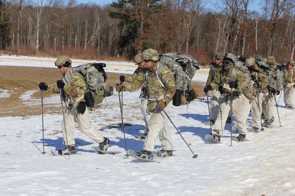 Fort McCoy Cold-Weather Operations Course students practice snowshoeing, ahkio sled use