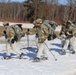 Fort McCoy Cold-Weather Operations Course students practice snowshoeing, ahkio sled use