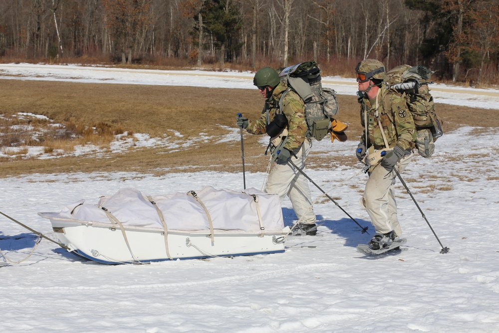 Fort McCoy Cold-Weather Operations Course students practice snowshoeing, ahkio sled use