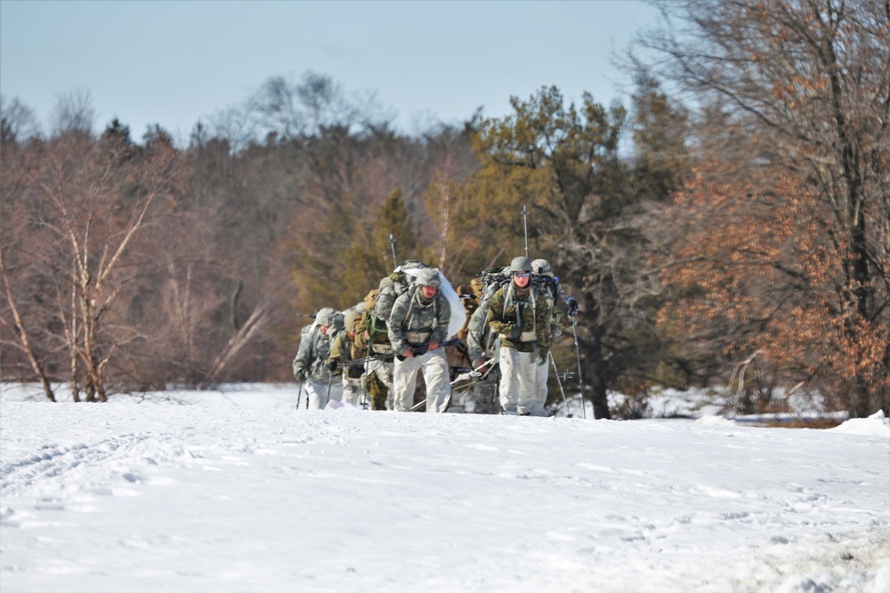 Fort McCoy Cold-Weather Operations Course students practice snowshoeing, ahkio sled use