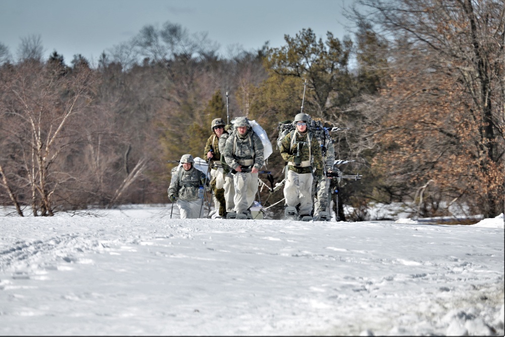 Fort McCoy Cold-Weather Operations Course students practice snowshoeing, ahkio sled use