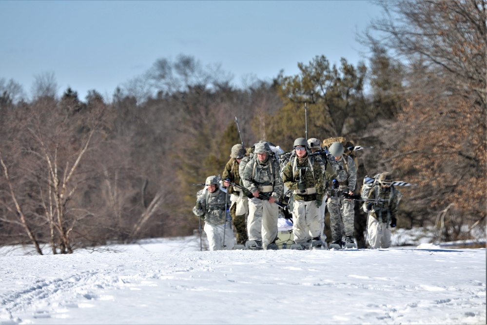 Fort McCoy Cold-Weather Operations Course students practice snowshoeing, ahkio sled use