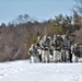 Fort McCoy Cold-Weather Operations Course students practice snowshoeing, ahkio sled use