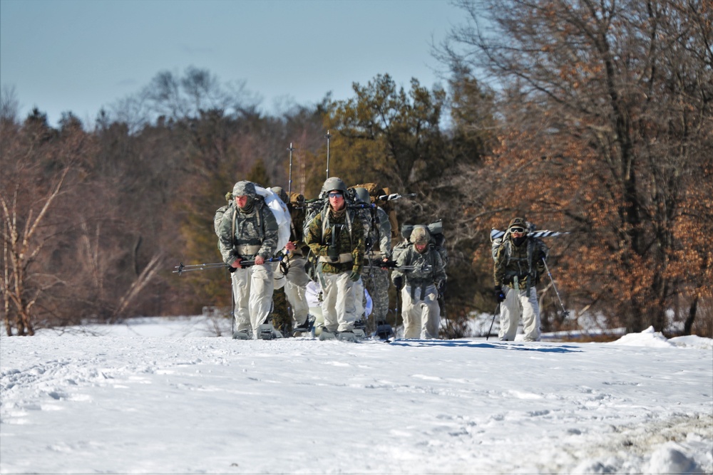 Fort McCoy Cold-Weather Operations Course students practice snowshoeing, ahkio sled use