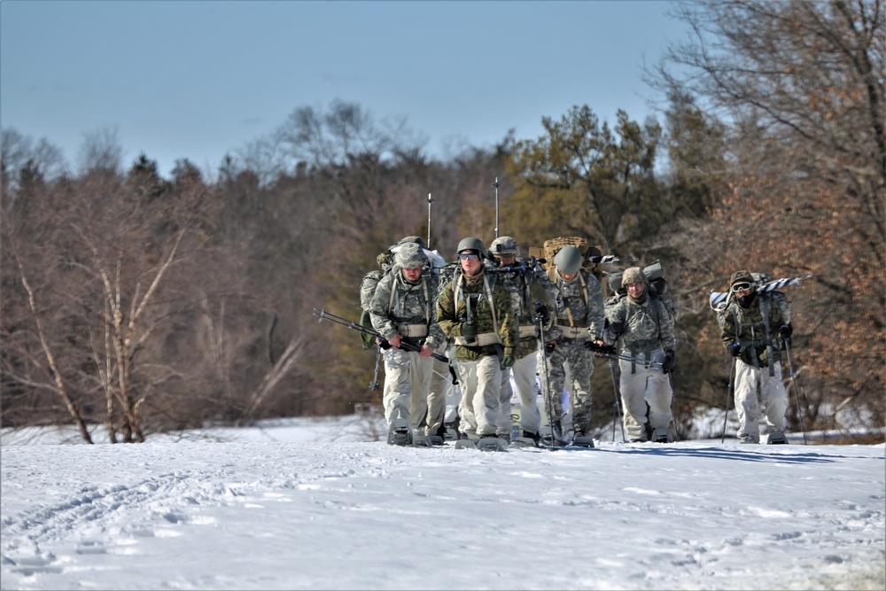 Fort McCoy Cold-Weather Operations Course students practice snowshoeing, ahkio sled use