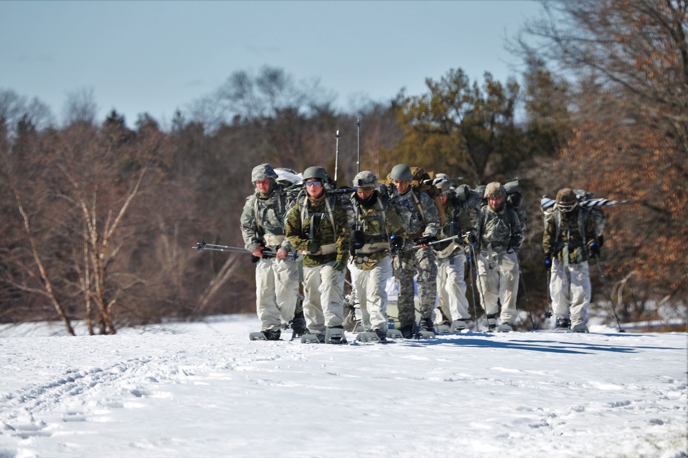 Fort McCoy Cold-Weather Operations Course students practice snowshoeing, ahkio sled use