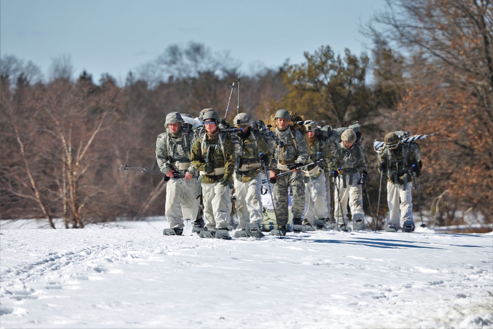 Fort McCoy Cold-Weather Operations Course students practice snowshoeing, ahkio sled use