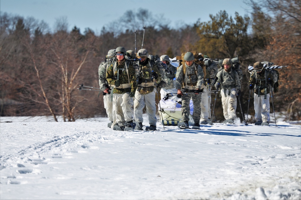 Fort McCoy Cold-Weather Operations Course students practice snowshoeing, ahkio sled use