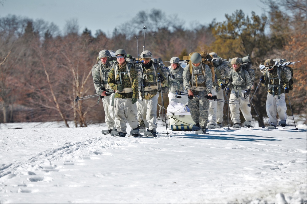 Fort McCoy Cold-Weather Operations Course students practice snowshoeing, ahkio sled use