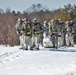 Fort McCoy Cold-Weather Operations Course students practice snowshoeing, ahkio sled use