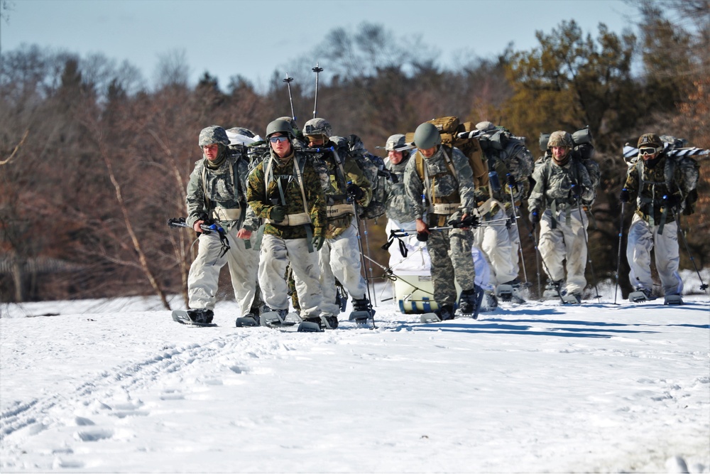 Fort McCoy Cold-Weather Operations Course students practice snowshoeing, ahkio sled use