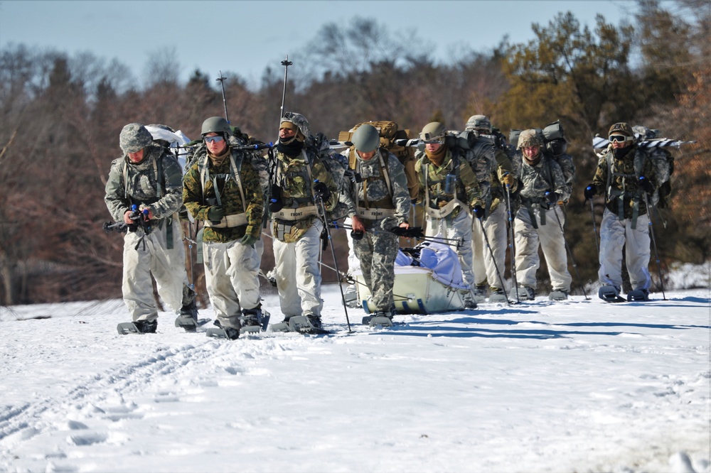 Fort McCoy Cold-Weather Operations Course students practice snowshoeing, ahkio sled use