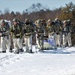 Fort McCoy Cold-Weather Operations Course students practice snowshoeing, ahkio sled use