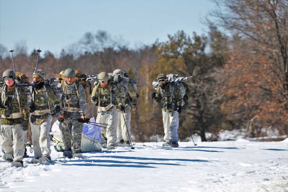 Fort McCoy Cold-Weather Operations Course students practice snowshoeing, ahkio sled use