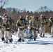 Fort McCoy Cold-Weather Operations Course students practice snowshoeing, ahkio sled use