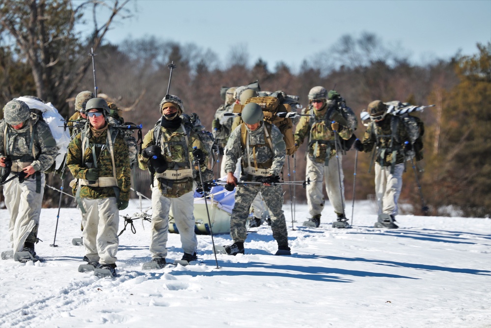 Fort McCoy Cold-Weather Operations Course students practice snowshoeing, ahkio sled use