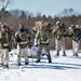 Fort McCoy Cold-Weather Operations Course students practice snowshoeing, ahkio sled use