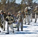 Fort McCoy Cold-Weather Operations Course students practice snowshoeing, ahkio sled use