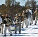 Fort McCoy Cold-Weather Operations Course students practice snowshoeing, ahkio sled use