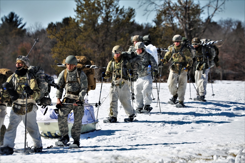 Fort McCoy Cold-Weather Operations Course students practice snowshoeing, ahkio sled use