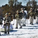 Fort McCoy Cold-Weather Operations Course students practice snowshoeing, ahkio sled use