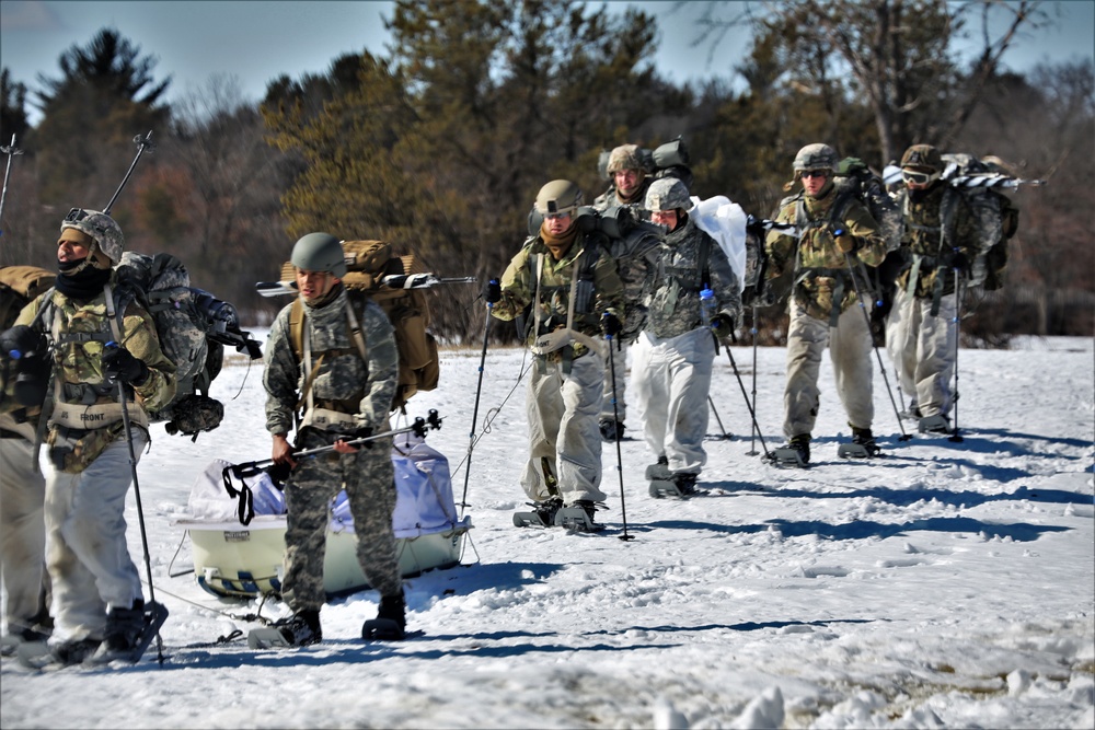 Fort McCoy Cold-Weather Operations Course students practice snowshoeing, ahkio sled use