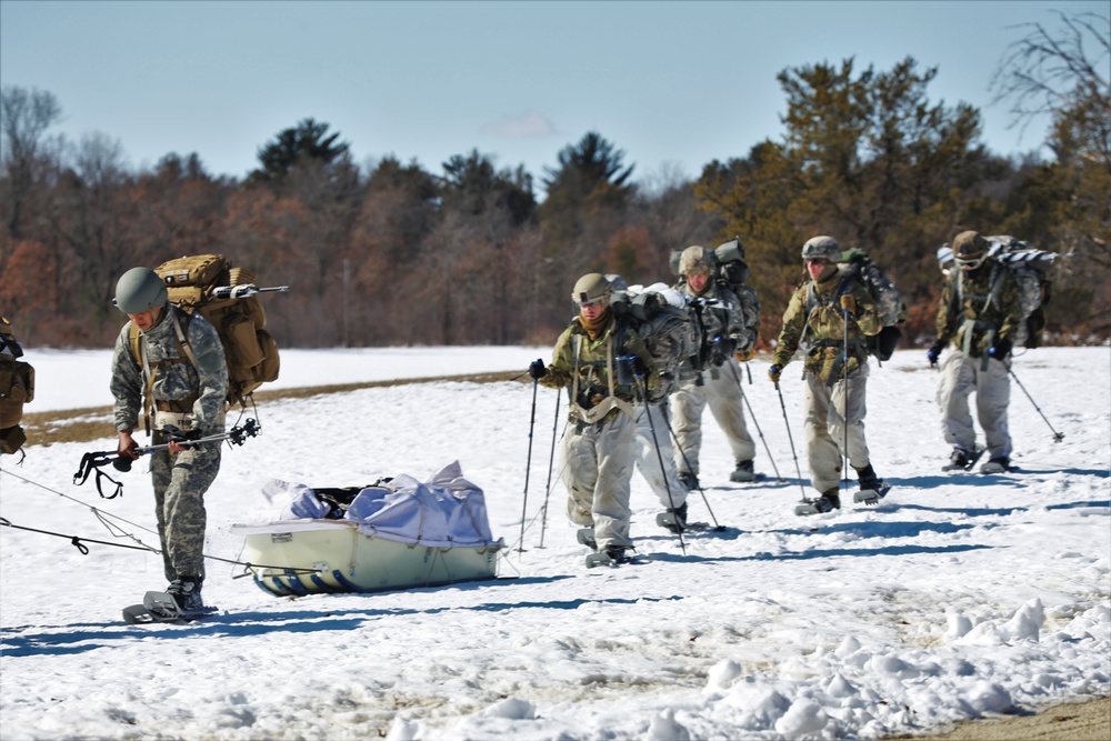 Fort McCoy Cold-Weather Operations Course students practice snowshoeing, ahkio sled use