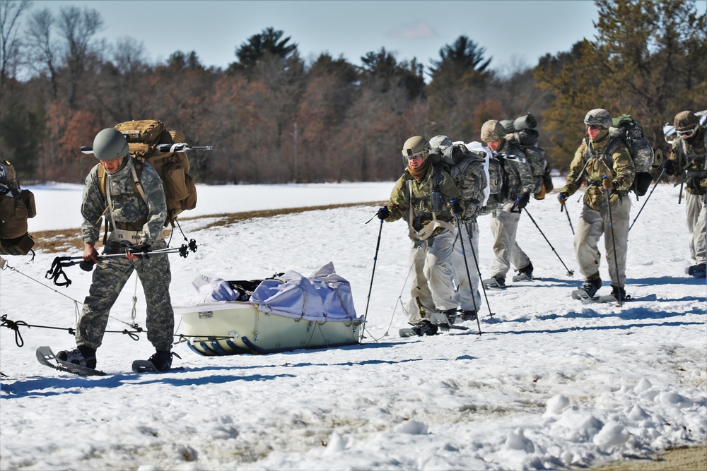 Fort McCoy Cold-Weather Operations Course students practice snowshoeing, ahkio sled use