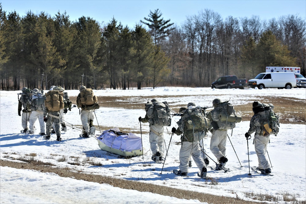 Fort McCoy Cold-Weather Operations Course students practice snowshoeing, ahkio sled use