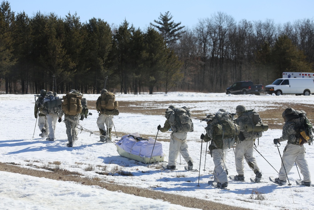 Fort McCoy Cold-Weather Operations Course students practice snowshoeing, ahkio sled use