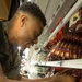 Marines Volunteer to restock the Commissary