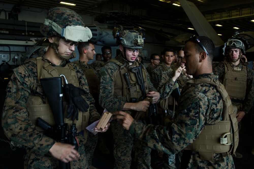 31st MEU Marines and sailors aboard USS America conduct live fire deck shoot