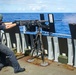 Sailor Fires M2HB Machine Gun