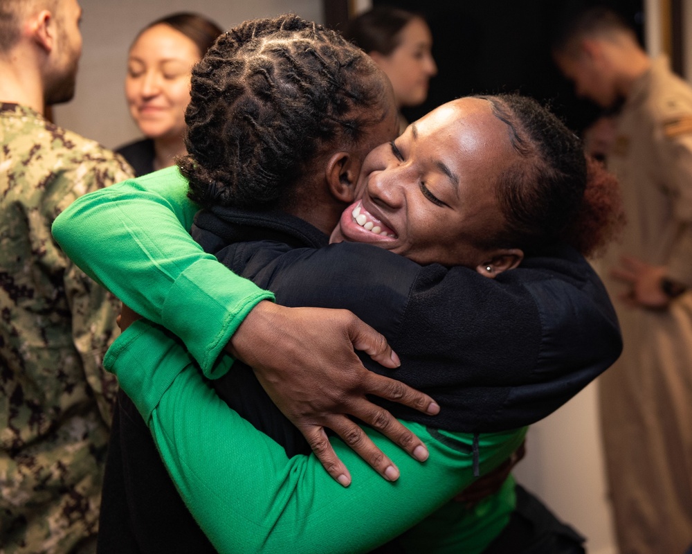 Deployed Aircraft Carriers Conduct Family Member Cross-Deck Visit