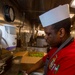 Sailors work in the galley