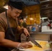 Sailors work in the galley